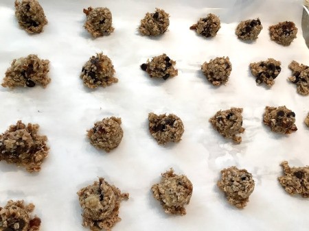 Banana Oatmeal Date Chocolate Chip Cookies on parchment paper