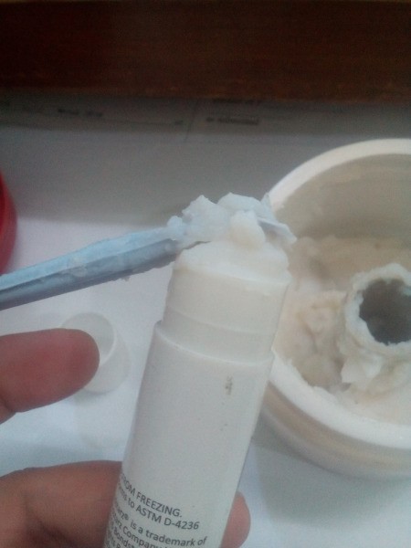 A glue stick that has been refilled with glue.