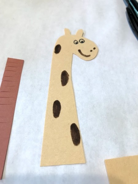 Standing Giraffe Toy - repeat making markings on the head, fringe the brown strips of paper