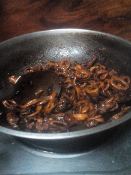 squid frying in pan