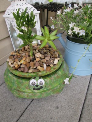 Terra Cotta Turtle Planter - planter sitting on a deck