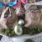 Making Bunny Bag Favors - bags clustered as a display with plastic eggs and moss