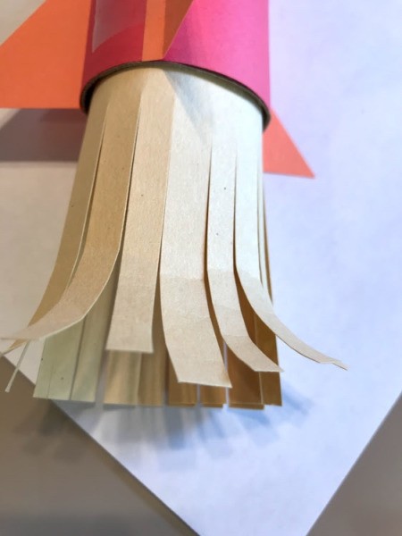 Paper Rocket Toy - roll ends of the slits with your hand