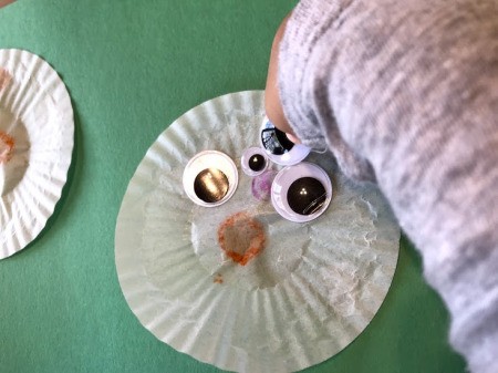 Making a Cupcake Liner Spider - glueing on google eyes