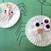 Making a Cupcake Liner Spider - finished spiders with legs and web drawn on for finishing touches