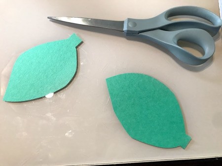 Making a Pom Pom Caterpillar - cut out paper leaf