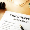 Legal paperwork for child support in the judge's chambers.