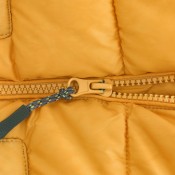Close up of a yellow jacket zipper.