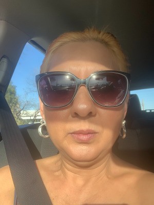 Hair Turned Orange After Dyeing - woman in a car wearing sunglasses