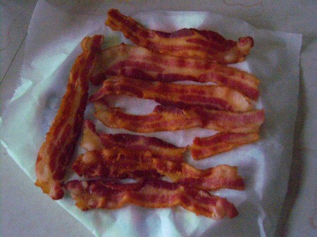 Ready Bacon Anytime - cooked bacon on a piece of parchment paper