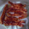 Ready Bacon Anytime - cooked bacon on a piece of parchment paper