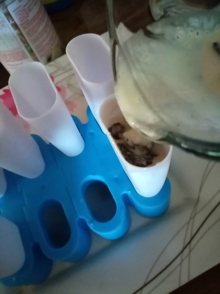 pouring batter in popsicle molds