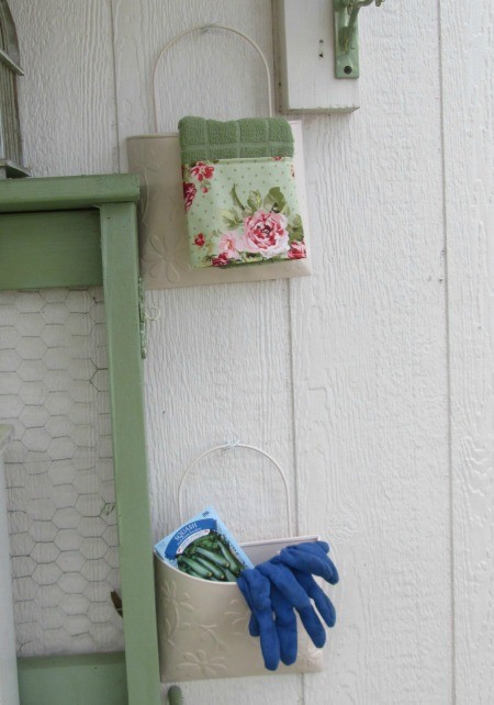 Bucket Garden Storage - 2 pails hanging on the side of a garden storage building