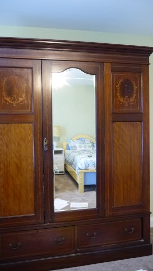 Determining the Value and Style of a Vintage Armoire - armoire with mirrored center door and two drawers