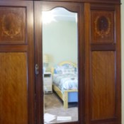 Determining the Value and Style of a Vintage Armoire - armoire with mirrored center door and two drawers