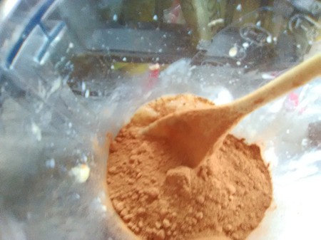 adding cocoa to blender