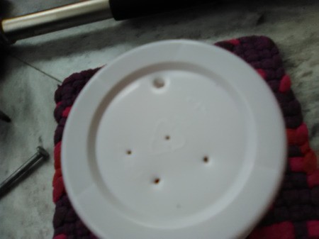 Up-cycled Seedling Pots - make 4-5 holes with one being larger