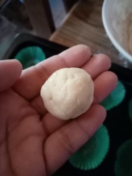 ball of dough in hand