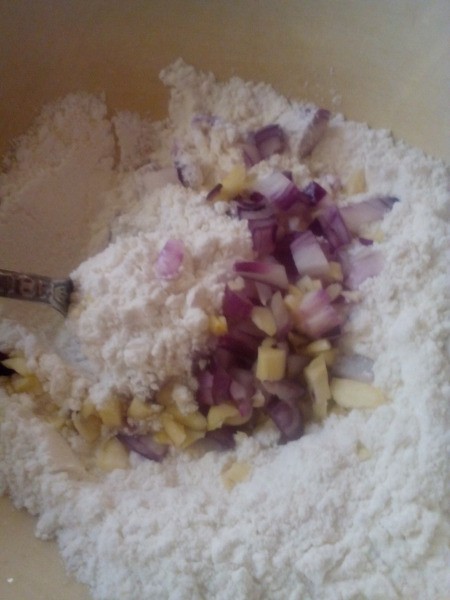 mixing flour, onions & garlic