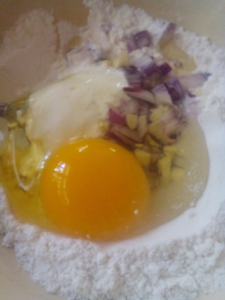 adding egg to dough