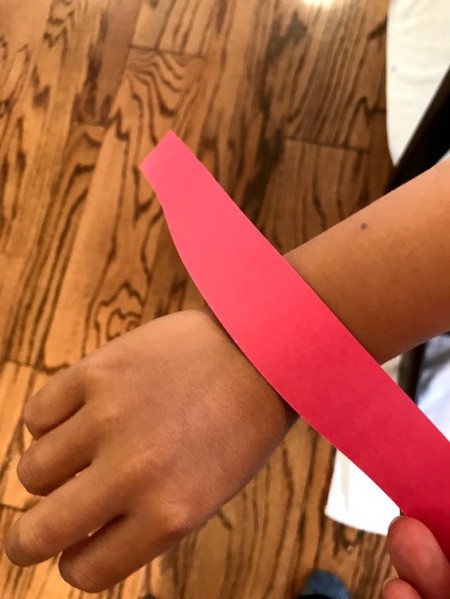 Making a Kid's Paper Butterfly Bracelet - measure the fit of the strip on your child's wrist