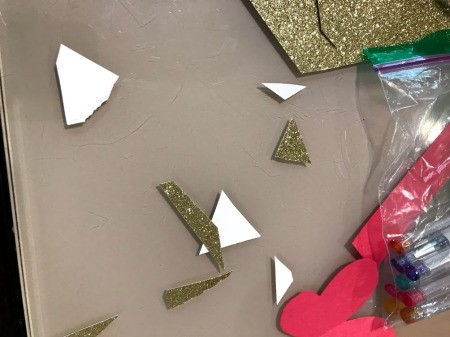 Making a Kid's Paper Butterfly Bracelet - bits of cut glitter paper