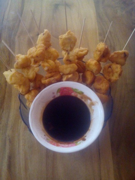 Flour Balls on skewers with bowl of sauce