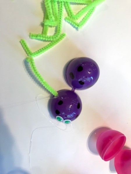 Plastic Egg Spider Craft - glue on the spider legs