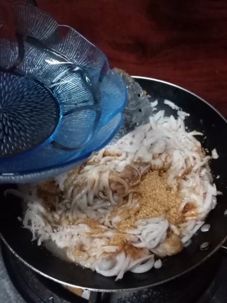 water added to coconut & sugar in pan