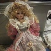 Identifying a Cathy Collection Porcelain Doll - blond doll wearing a pink and white lacy dress