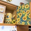 Above the Stove Sunflower Collection - view of one side of cabinet and fabric draped door and coffee pot