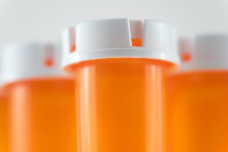 Closeup to prescription bottles.