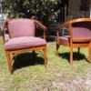 Value of African Teak Chairs - two light wood upholstered chairs