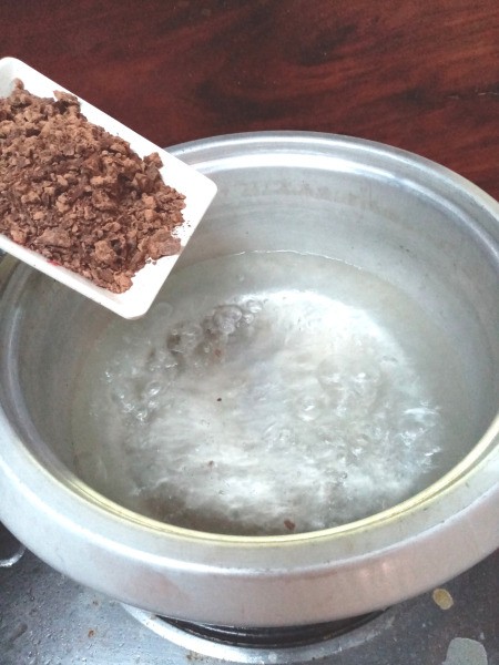 adding crushed tablea to pot