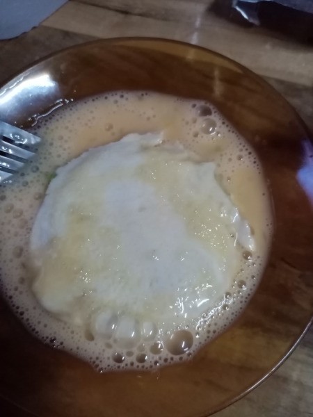 dipping Roundwich in egg