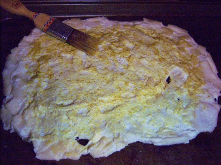 dough spread with mustard