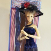 Identifying a Cathay Collection Porcelain Doll - tall slender doll in fancy dress and hat