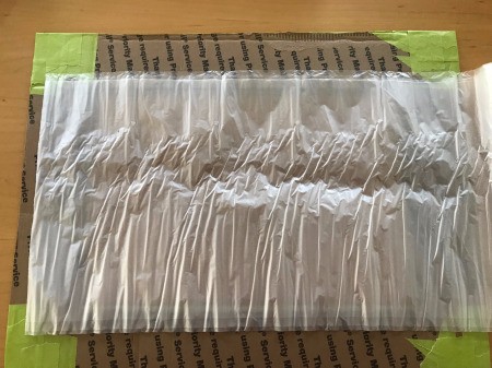 DIY Privacy Screen for Windows - flip frame over and lay trash bag on top