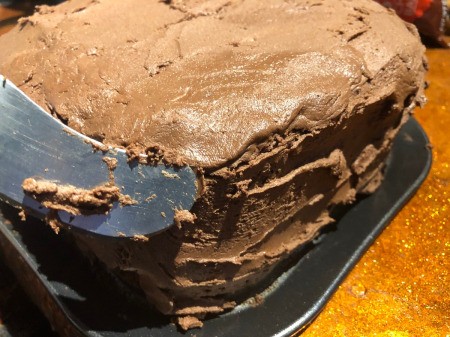 DIY Turntable Cake - frost the top and sides of the cake, smooth bumps