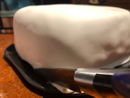 DIY Turntable Cake - smooth out any bubbles and use the sharp knife to trim bottom edge