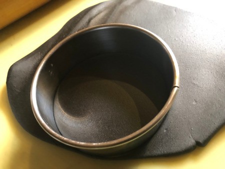 DIY Turntable Cake - knead and roll out the black fondant to 1/8th inch, use a smaller ring to cut out the record