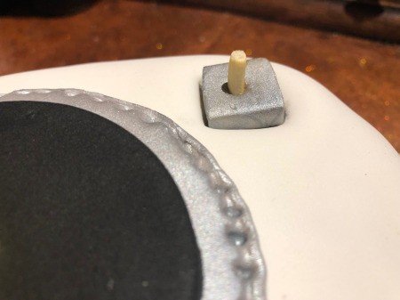 DIY Turntable Cake - cut off the bottom of the other Pocky stick and place in the hole