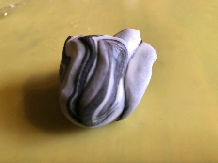 DIY Turntable Cake - twist together some black and white fondant to look like marble for the brand placard