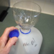 Recycling Used Motor Oil - soda bottle funnel in milk jug