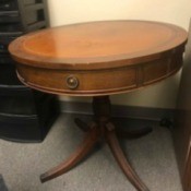 Value of a Brandt Drum Table and Butler Grandmother Clock - round pedestal table