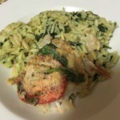 Topped Broiled Haddock and rice pilaf on plate