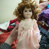 Identifying Porcelain Dolls - pink and white lace dress