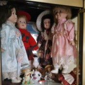 Value of The Four Seasons Collection Dolls - dolls in a display case