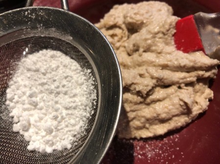 sifting powdered sugar to Banana & Walnuts