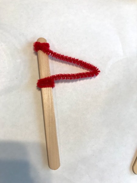 Recycled Plastic Bottle Boat - create a flag from a craft stick and a pipe cleaner